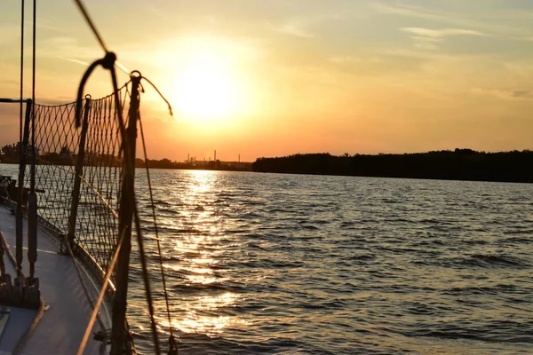 Sunset sailing on the river Stock Image