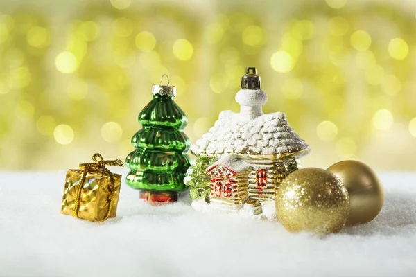 Christmas decorations, vintage house toy on golden bokeh defokus