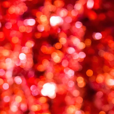 Kırmızı soyut bokeh ışıkları, parlayan odaklanmış arkaplan.