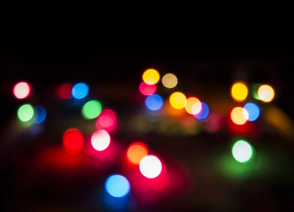 Christmas blurred lights on dark  background. Decorative bokeh l — Stock Photo, Image
