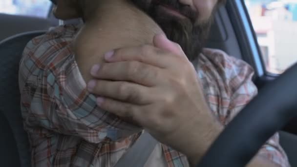 Male driver massaging arm to relieve elbow pain, joint inflammation, health — Stock Video