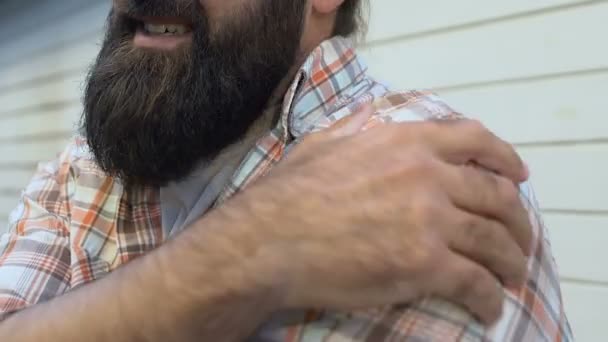 Tired male worker exercising to relieve shoulder pain, joint health problems — Stock Video