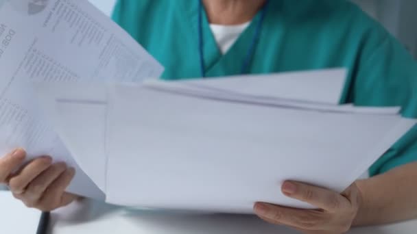 Senior female doctor signing medical documents, pharmacological research — Stock Video