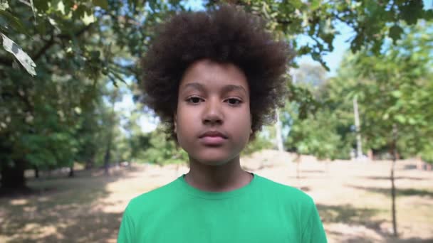 Mixed raced boy feeling surprised, touching face with palms, shock content — Stock Video