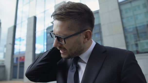 Male entrepreneur in glasses suffering neck pain, muscle spasm, inflammation — Stock Video