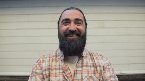 Portrait of bearded man smiling on camera, working-class representative, farmer — Stock Video