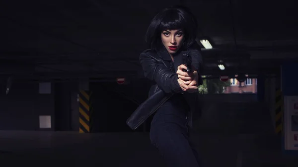 Beautiful brunette sexy spy agent (killer or police) woman in le