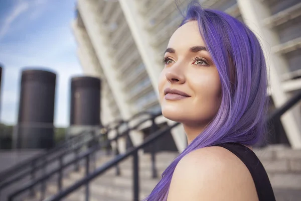 Beautiful brunette woman with colored (purple violet blue) hair — Stock Photo, Image