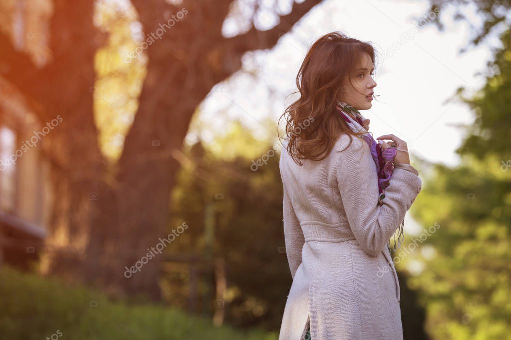 Cute ordinary caucasian brunette woman in casual outfit walking 