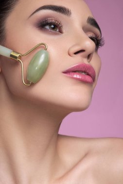 Cosmetology treatment on a brunette caucasian woman face. Fresh, clipart