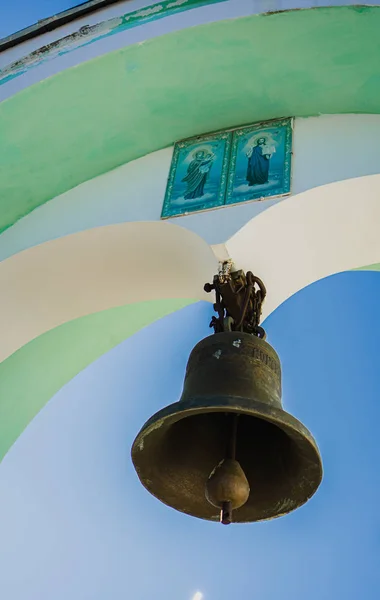 bell and icons on sky background