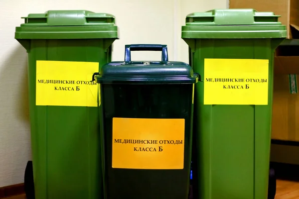 green container labeled Class B medical waste for medical waste collection in healthcare facilities