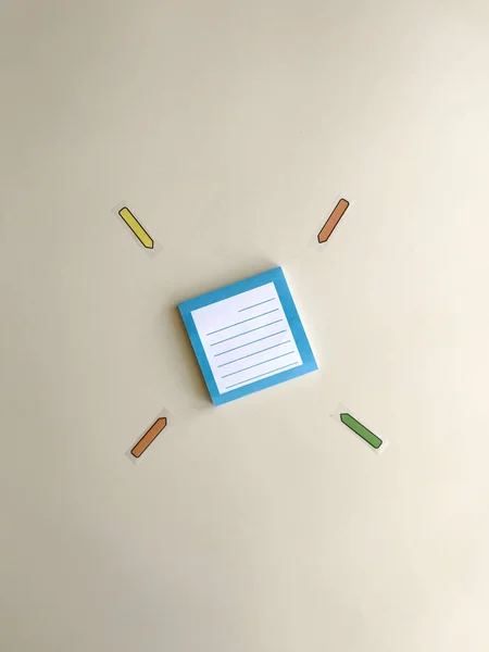 blue stickers for writing cases on a table on a beige background