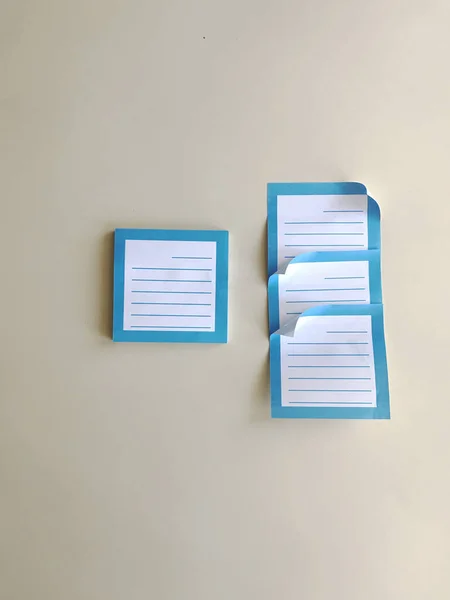 blue stickers for writing cases on a table on a beige background