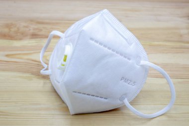 Health mask to prevent PM2.5 on wooden background