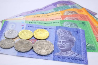 Malaysian ringgit banknotes on white background.