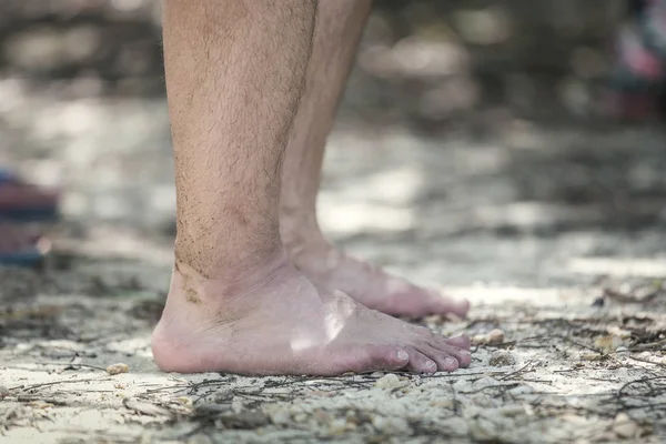 barefoot man closeup