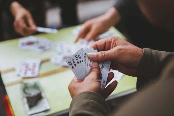 Closeup People Playing Card Game Stock Photo