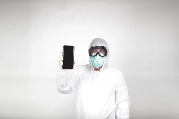 Portrait Man Surgical Mask Wearing White Protective Suit Mobile Phone — Stock Photo, Image