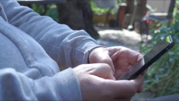 Hands Man Using Smartphone Writes Text Foreground Closed Plane — Stock Video