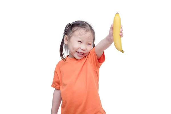 Girl holding banana over white background — Stock Photo, Image