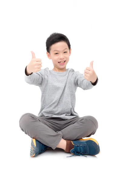 Boy smiles and showing thumb up over white — Stock Photo, Image