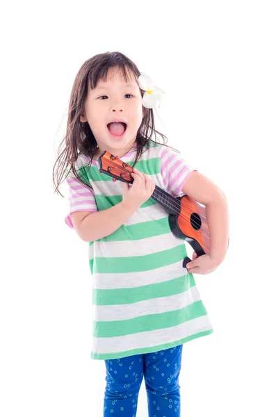 Niña jugando juguete de guitarra sobre fondo blanco —  Fotos de Stock