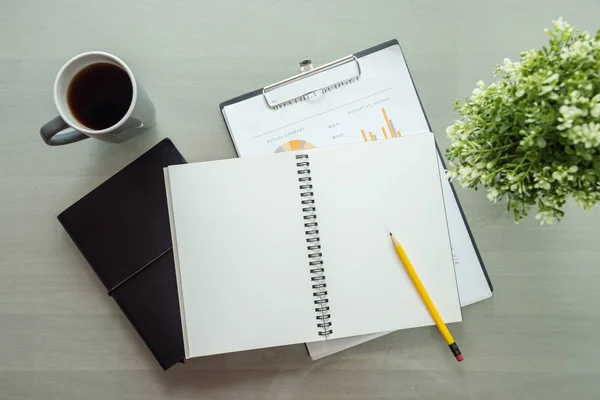 Notebook with copy space and coffee cup on table — Stock Photo, Image