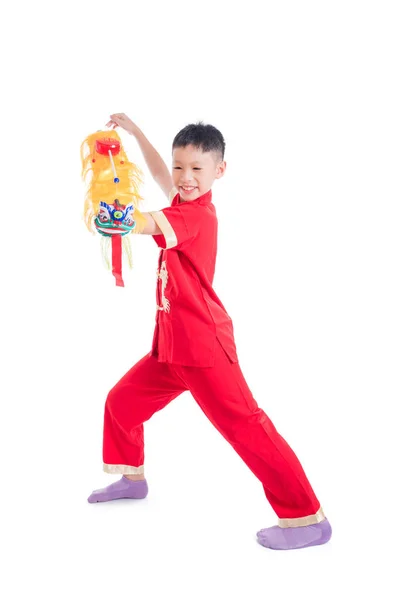 Boy in red color traditional dress playing chinese lion puppet — Stock Photo, Image