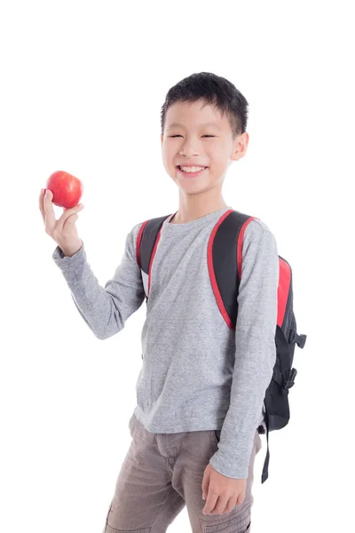 Schuljunge mit Rucksack lächelt über weißem Hintergrund — Stockfoto