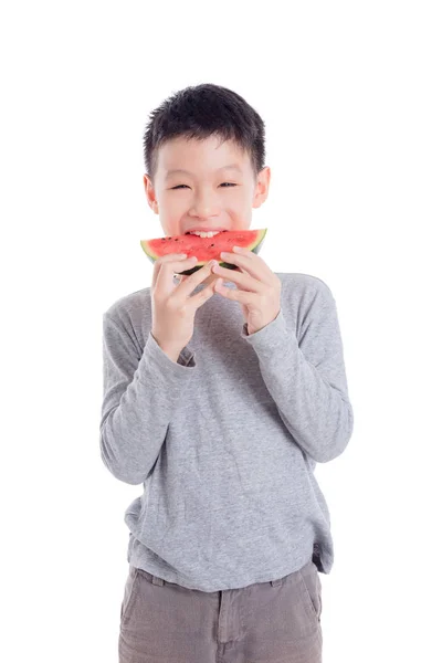 Boy eating a slice of watermelon over white background — Stock Photo, Image