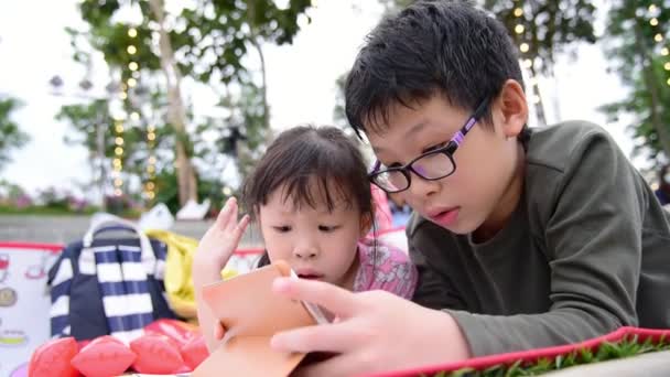 Little Girl Boy Playing Games Tablet Computer Lying Floor Park — Stock Video