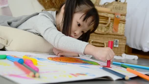 Little Asian Girl Drawing Picture Crayon Pencils Floor Home — Stock Video