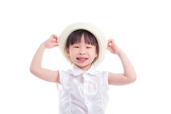 Menina vestindo chapéu e sorrisos sobre fundo branco — Fotografia de Stock