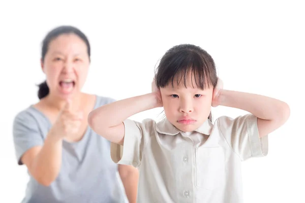 Displeased Girl covering her Ears from Scolded by her mother — Stock Photo, Image