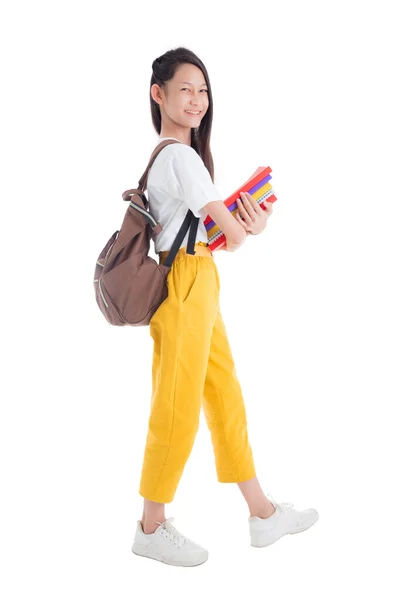 Full length of Beautiful asian teenage girl holding books — Stock Photo, Image