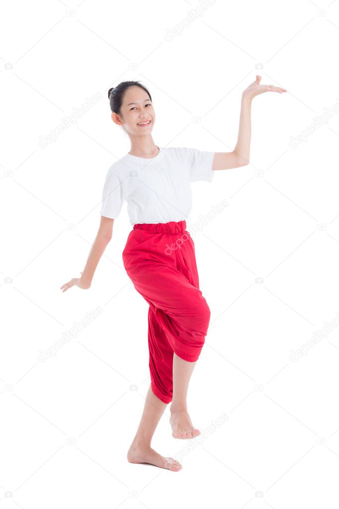 Full length of pretty Thai girl with traditional Thai student dress showing Thai style dance