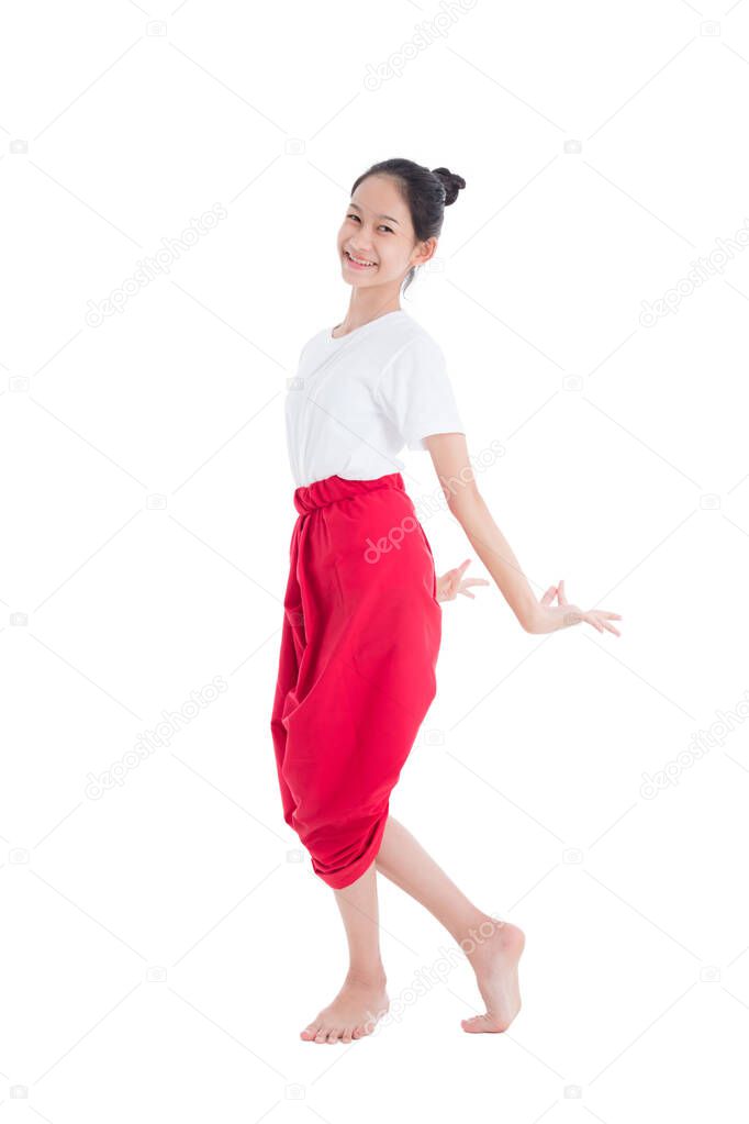 Full length of pretty Thai girl with traditional Thai student dress showing Thai style dance