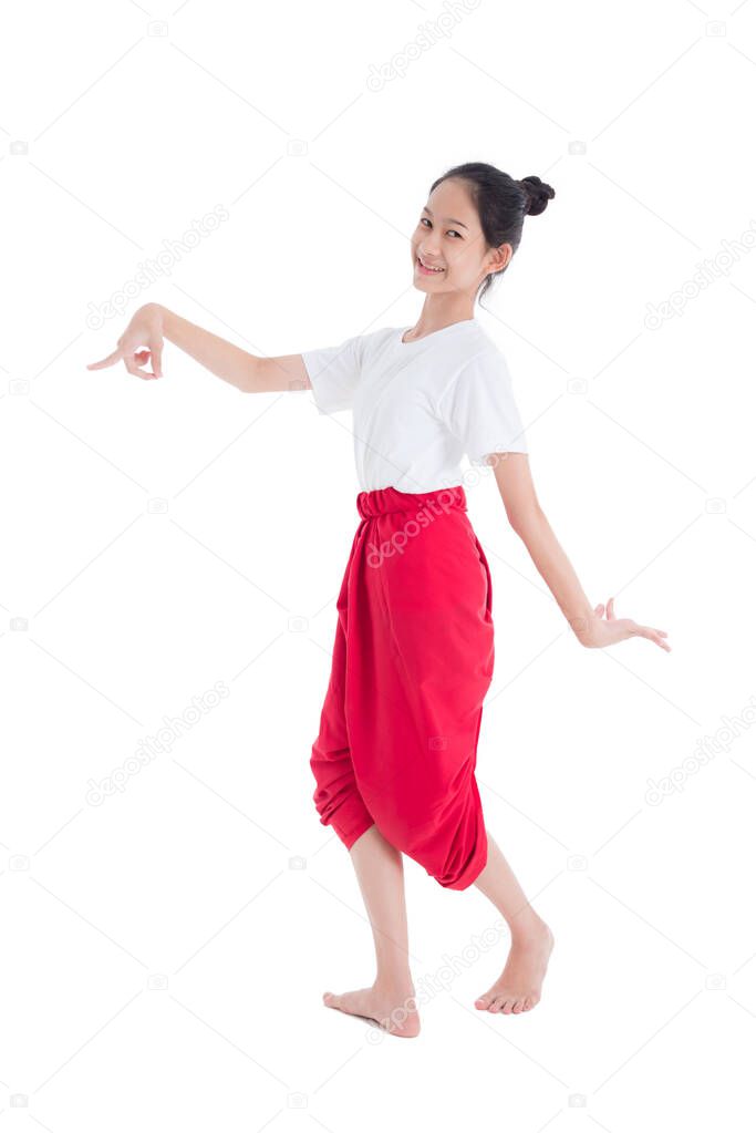 Full length of pretty Thai girl with traditional Thai student dress showing Thai style dance