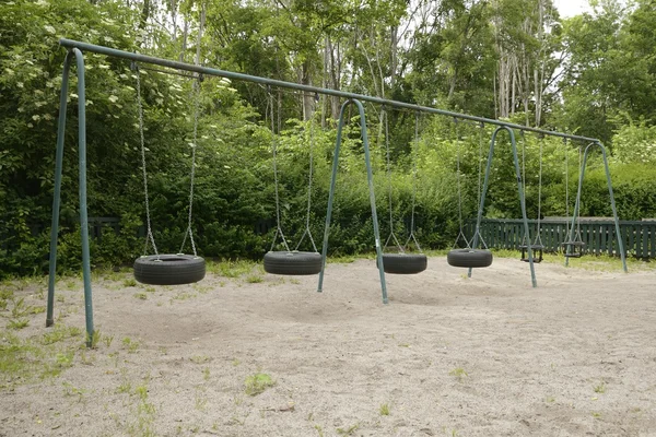 Empty and forgotten swing — Stock Photo, Image