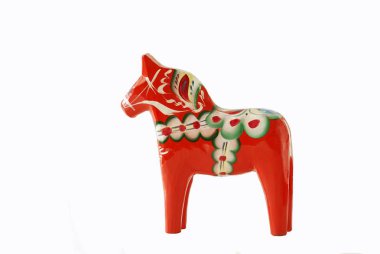 Swedish dalahorse figurine on a white background clipart