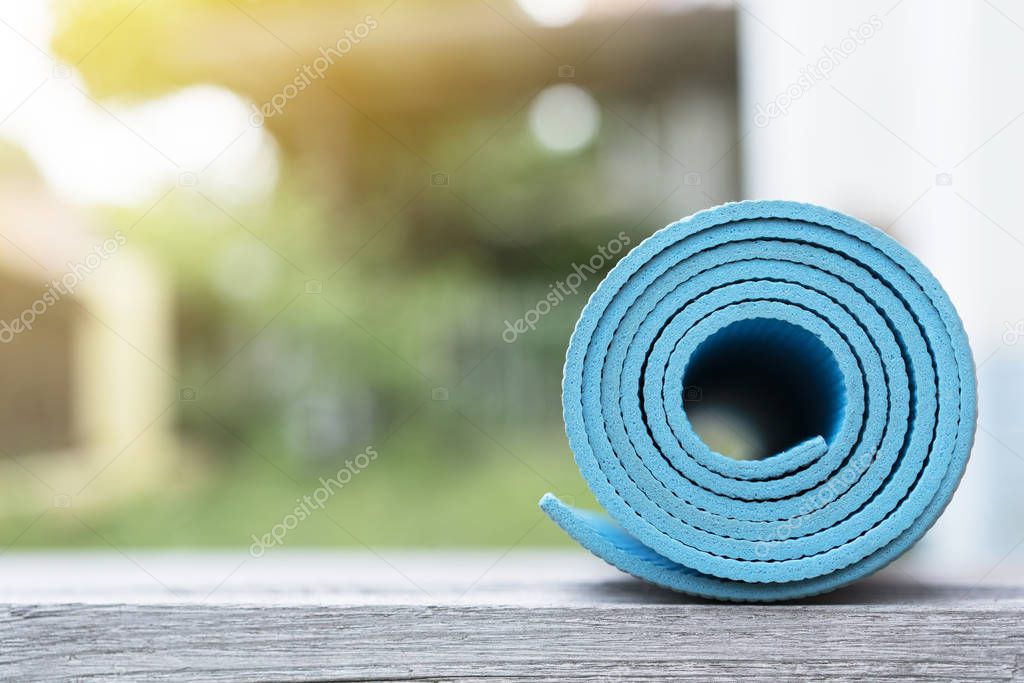 blue yoga mat sport and healthy concept