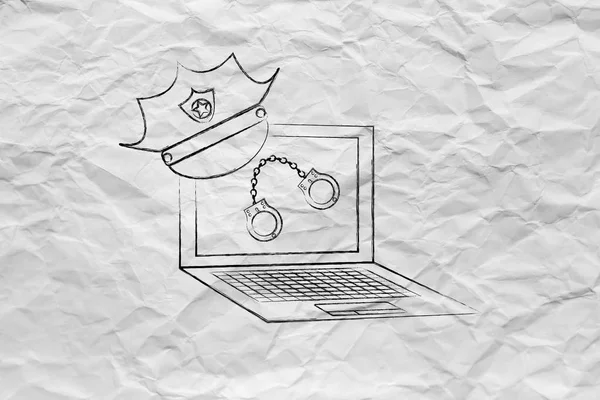 laptop with police hat & handcuffs, against piracy or cyber cri