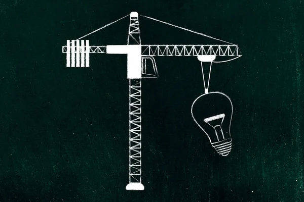 Tower crane lifting up a huge lightbulb, building innovation — Stock Photo, Image