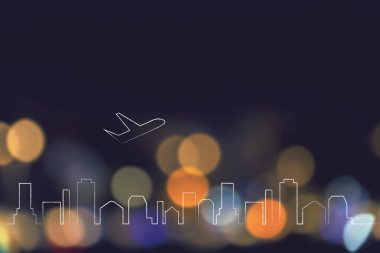 şehir manzarası ve gece ışıklar bokeh üzerinde kalkış uçak