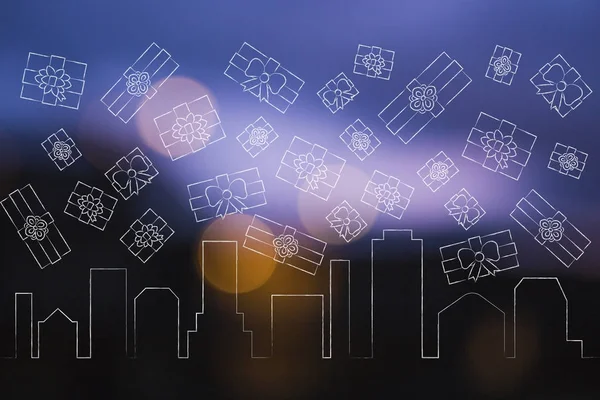 Ciy skyline with presents falling from the sky — Stock Photo, Image