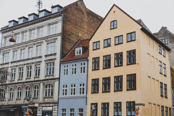 COPENHAGEN, DENMARK - March 11th, 2018: Architecture and buildings of the streets of Copenhagen featuring the typical Scandinavian style