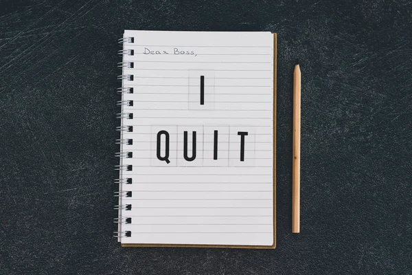 Dear boss I quit message on notebook — стоковое фото