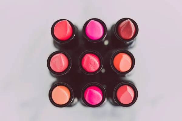 beauty industry still-life with group of colorful lipsticks in s