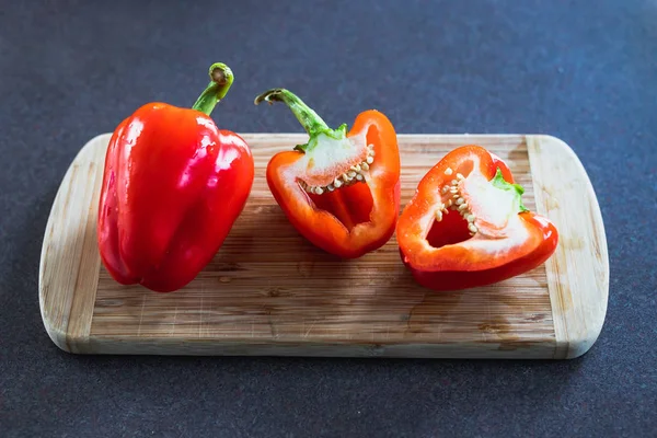 meal prepping concept, red bell peppers on cutting board with on